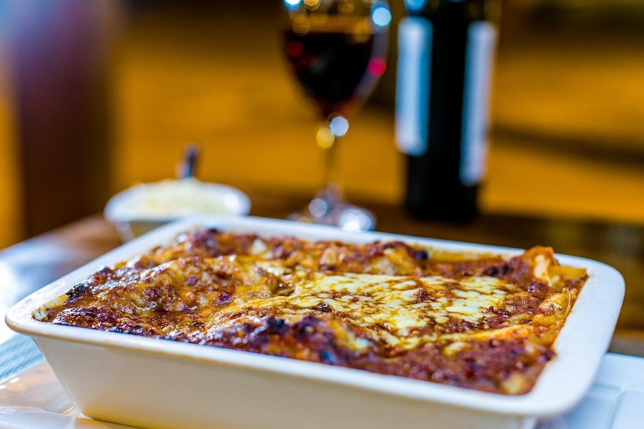 meal, dish, plate, pasta, lasagna, cheesee, table, table setting, wine, glass, dinner, lasagna, lasagna, lasagna, lasagna, lasagna